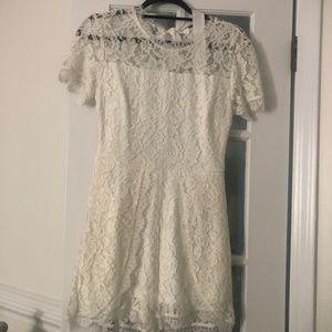 Small white lace romper. Still has the tag